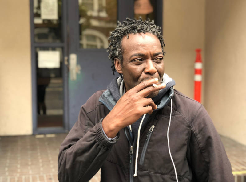 Sean Kayode, outside the Next Door homeless shelter in San Francisco on July 26, 2018. Kayode is suing the city, saying he lost his means of food-delivery employment and his home when his car was impounded in March — for having too many parking tickets.