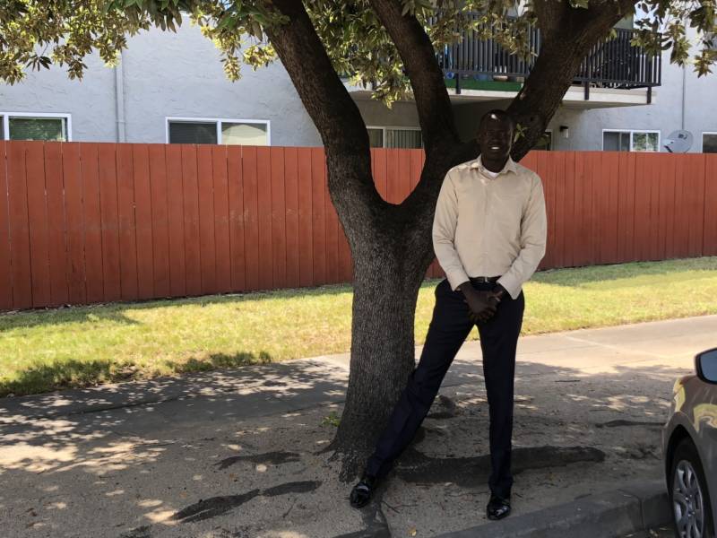 David Ayual Mayom stands outside his apartment in San Jose. "I tend to think the life that I had makes me stronger now," he said about the perilous journey he walked from Sudan to Ethiopia as one of The Lost Boys of Sudan.