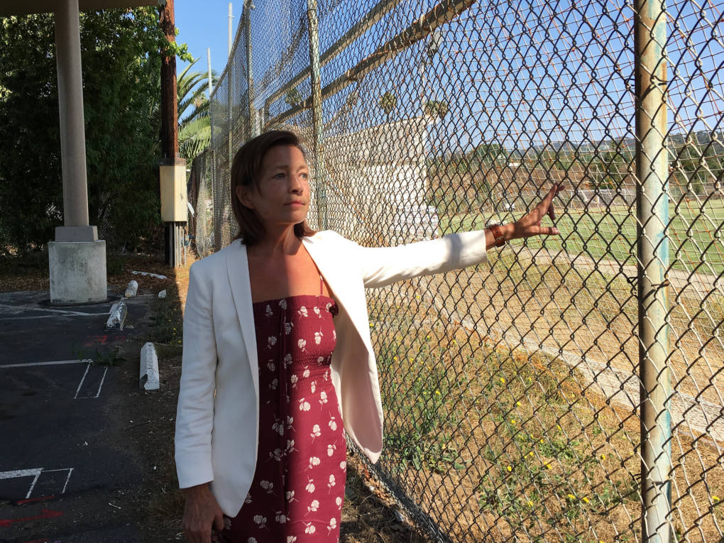 Meghan Flanz is in charge of turning the VA West Los Angeles campus into a community for at least 1,200 chronically homeless veterans. She hopes this former soccer field will be turned into new housing for female veterans and their children.