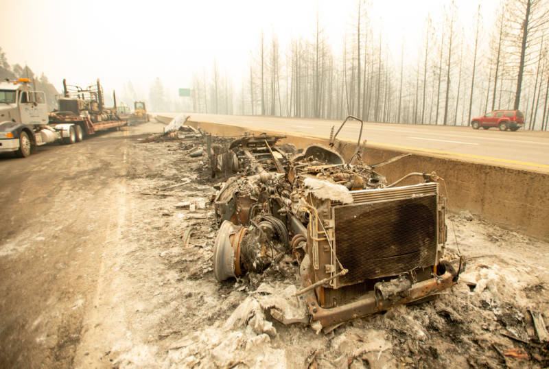 The remnants of a burned-out big rig sit along Interstate 5 during the Delta Fire in the Shasta Trinity National Forest on September 6, 2018.