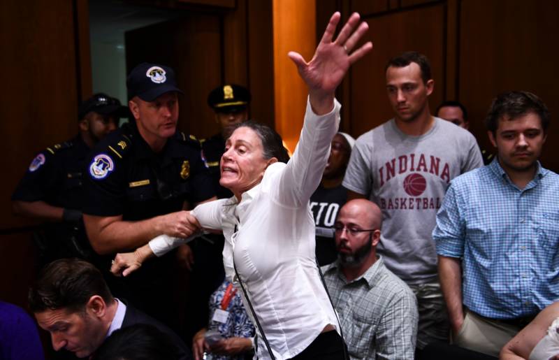 A protester shouts during a hearing of the Senate Judiciary Committee on the nomination of Brett Kavanaugh to the U.S. Supreme Court September 4, 2018.