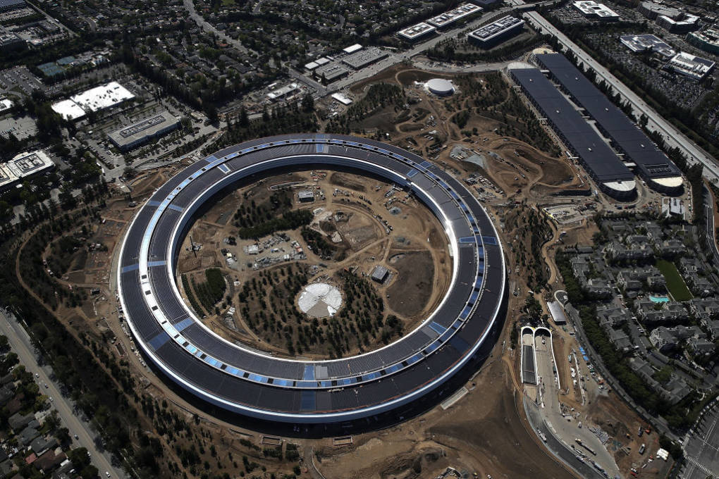 An aerial view of the new Apple headquarters on April 28, 2017 in Cupertino, California. Apple's new 'spaceship' 175-acre campus dubbed "Apple Park" is nearing completion and is set to begin moving in Apple employees. The new headquarters, designed by Lord Norman Foster and costing roughly $5 billion, will house 13,000 employees in over 2.8 million square feet of office space and will have nearly 80 acres of parking to accommodate 11,000 cars. 