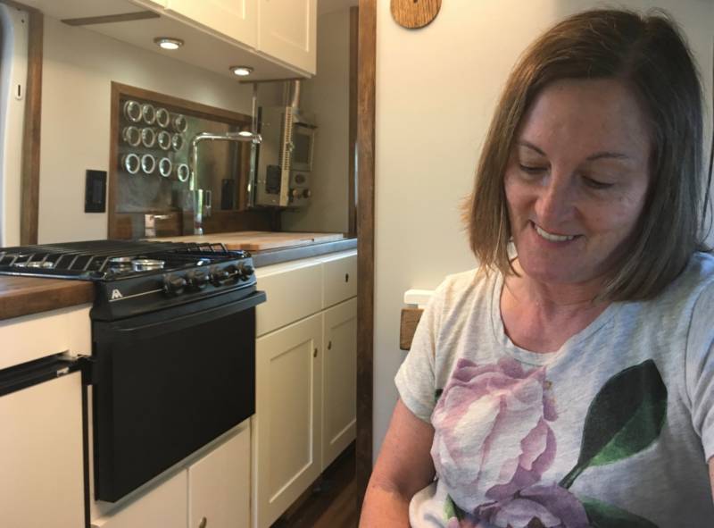 Mercury News reporter Tracey Kaplan is thrilled with her just-arrived, customized Ford Transit. On the left, the kitchen sports a fridge, three-burner stove, oven and a 29-inch sink Kaplan considers the 'crown jewel' of the van. 'Cause I love to cook. I'm kind of a foodie.'