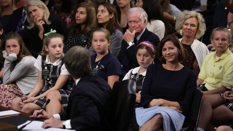 Children who played on sports teams coached by Supreme Court nominee Judge Brett Kavanaugh, along with his wife Ashley Kavanaugh and daughters, 2nd right to left, Lisa and Margaret Kavanaugh, and parents Everett and Martha Kavanaugh, attend the third day of his confirmation hearing before the Senate Judiciary Committee Sept. 6, 2018.