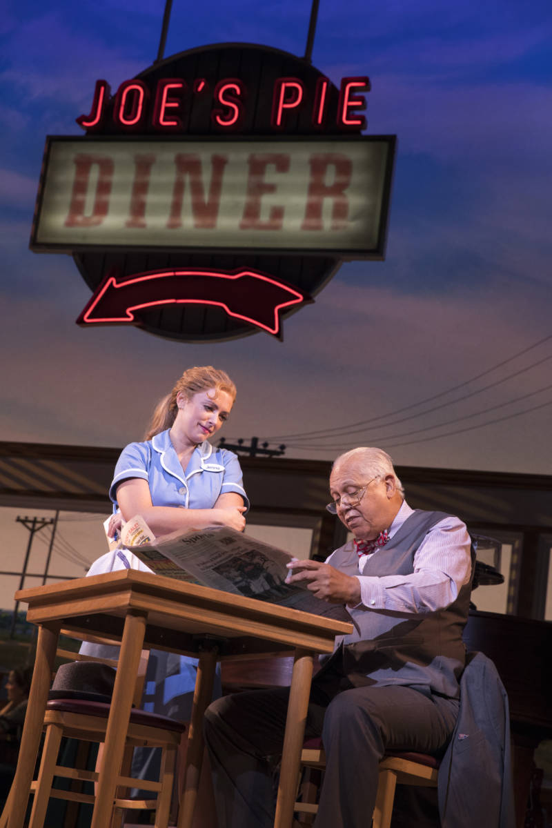 A scene from "Waitress" featuring Desi Oakley as Jenna and Larry Marshall as Old Joe.