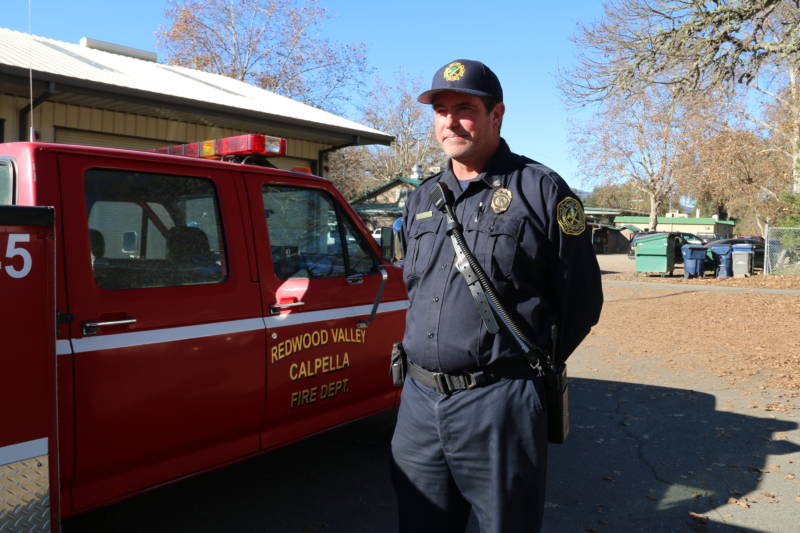 Brendan Turner stands by his fire truck behind the Redwood Valley Fire Department in Mendocino.
