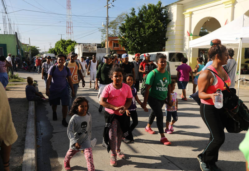 Some of the thousands of Central American migrants arrive into the small town of Santiago Niltepec on Oct. 29, 2018 in Santiago Niltepec, Mexico. Following a break on Sunday, the migrants, many of them fleeing violence in their home countries, resumed their march towards the U.S. border. As fatigue from the heat, distance, and poor sanitary conditions has set in, the numbers of people participating in the march has slowly dwindled, but a significant group are determined to get to the United Sates. 