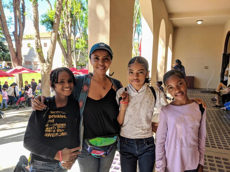 Tanya Akbar brought her two daughters and niece from Oakland to Girls' Festival. 'I thought it would be important for them to see young girls in entrepreneur and leader roles, and really see the importance of coming together and supporting and uplifting one another.'