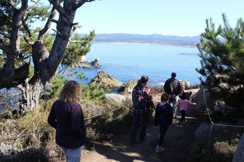 A family from Texas hikes through Point Lobos State Natural Reserve. One of the park's main jobs will be publicizing the new reservation rule as the park attracts visitors from around the world.