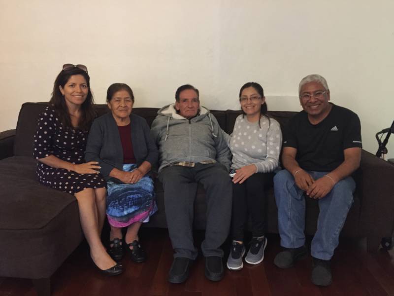 Marisol Necochea (L) sits with her parents, sister and brother-in-law in Santa Clara.