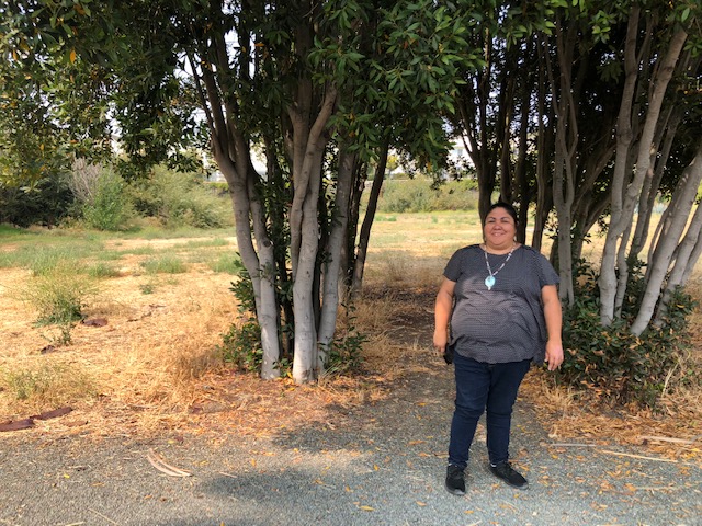 Corrina Gould stands in front of the site of a former shellmound and village known to Ohlone as Sigorea Te. This place is also called Glen Cove Waterfront Park.