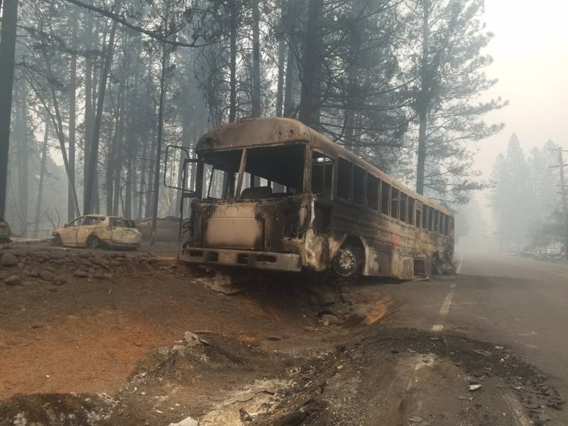 A burned bus sits along Skyway road in Paradise on Nov. 13.
