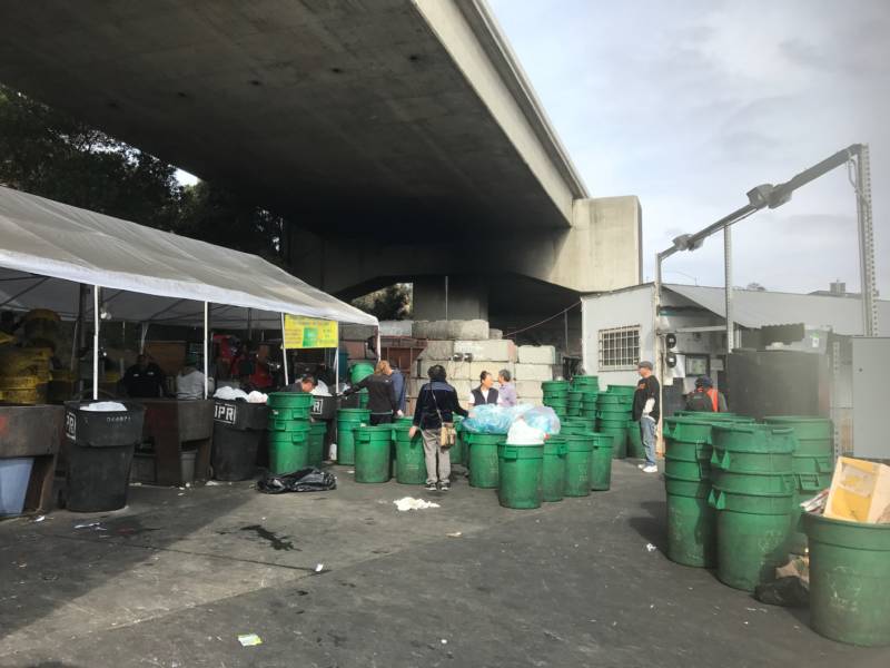 Customers line up with their bins of recyclables at Our Planet Recycling SF.