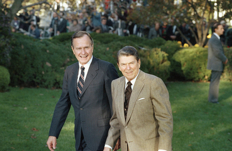 President Ronald Reagan (right) greets President-elect George H.W. Bush upon his arrival at the White House on Nov. 10, 1988.