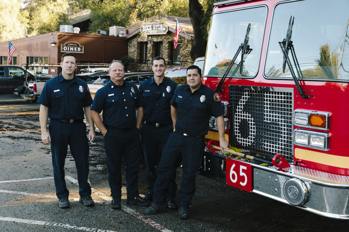 Los Angeles County firefighters, from left: Brian Knutson, Jay Colvin, Adam Young and Marcus Carballo. Knutson lives in the community and says this is the worst fire any of them can ever remember. "It's always hard to talk to someone that's lost their house," he says. "I wish we could have done more for them."
