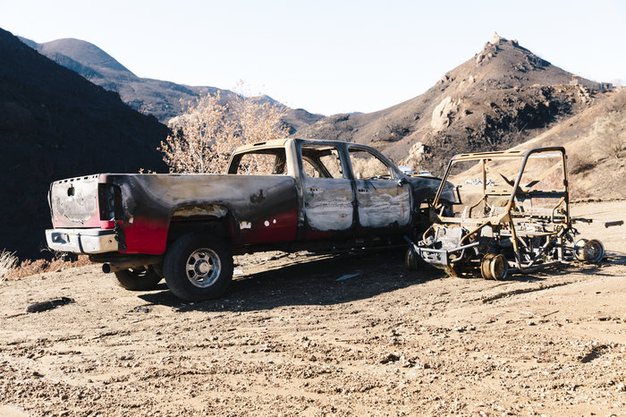 A few of the burned-out vehicles on Jones' property. The truck he used to escape during the fire is heavily blistered by fire, but still intact.