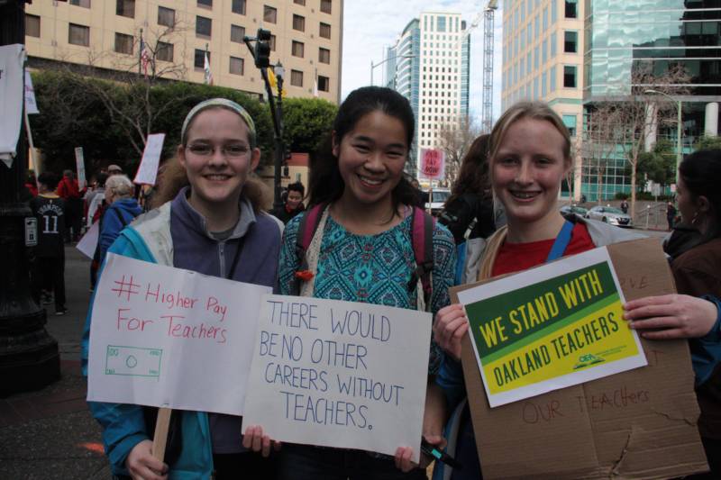 Oakland Technical High School students Percy Unger, Caitlin Lee and Josie Goodson (L-R) joined in the teacher walkout and rally, Jan. 18, 2019