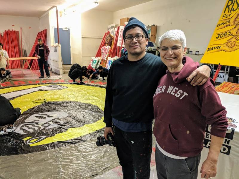 (L-R) Claudio Martinez and Kim Cosier are both artists involved with the collective Art Build Workers in Milwaukee, Wisconsin. They came to Oakland to support the 'art build' event.