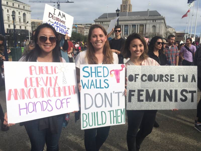 Erica Yarborough, Shannon McCarty, and Sheryl Fuehrer are Stanford students at the San Francisco Women's March. Fuehrer is thinking about the government shutdown: 'I think it's extremely sad and really goes against what both Republicans and Democrats want to see in our country right now.'