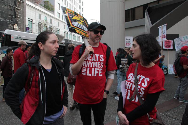 Oakland High School teachers Roxanne Clement, Payton Carter and Jessica Ford (L-R) marched to Oakland Unified School District’s headquarters in downtown Oakland. Ford said she’d like to see the prosperity of many parts of the Bay Area be reflected in school budgets.