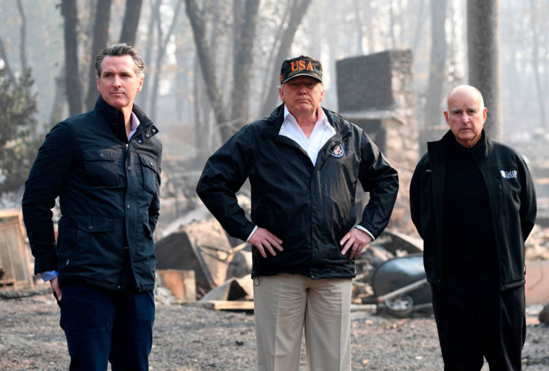Then-Lt. Gov. Gavin Newsom, President Trump and then-Gov. Jerry Brown view devastation caused by the Camp Fire in Paradise on Nov. 17, 2018.