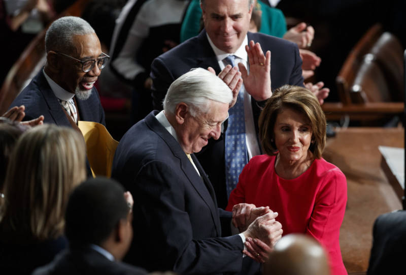 New Speaker of the House Nancy Pelosi and Steny Hoyer, D-Md., are applauded at the Capitol on Thursday as Democrats officially regain control of the chamber.