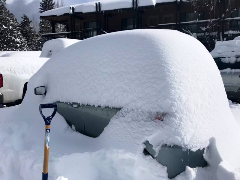 A Toyota Yaris buried by snow on Lake Tahoe Boulevard.