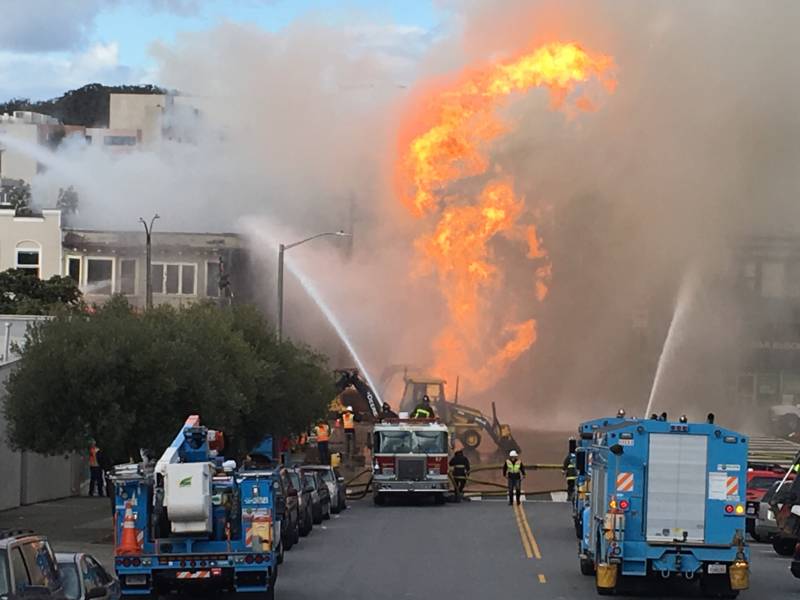 Crews from PG&E and the San Francisco Fire Department at the scene of a natural gas blast and fire on Geary Boulevard in the city's Inner Richmond neighborhood.