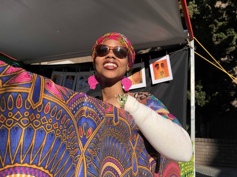 Tiana Dorley helps artists friends at the Black Joy Festival in Oakland.
