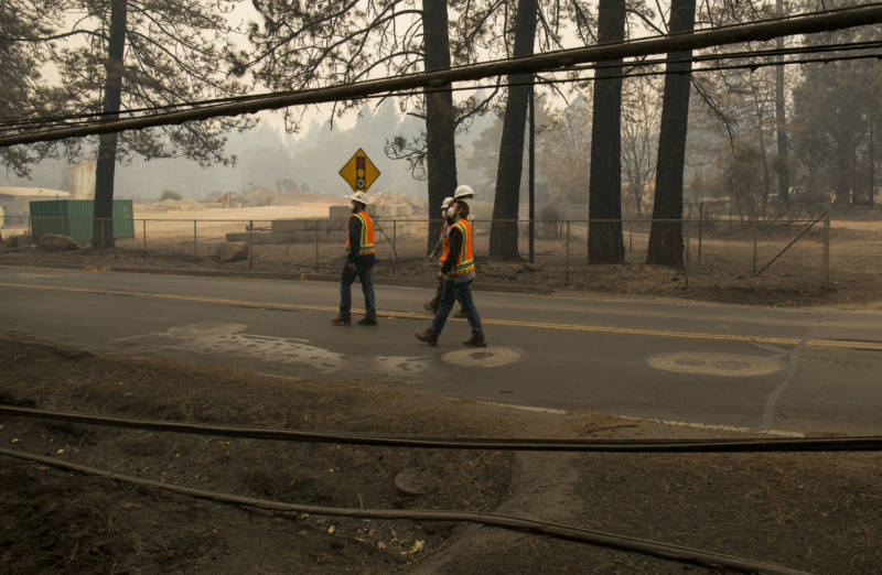 PG&E subcontractors walk along Skyway to assess vegetation at risk for catching fire on November 13, 2018.