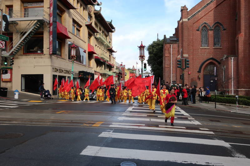 Performers get in position for their march down California Street in San Francisco's Chinatown.