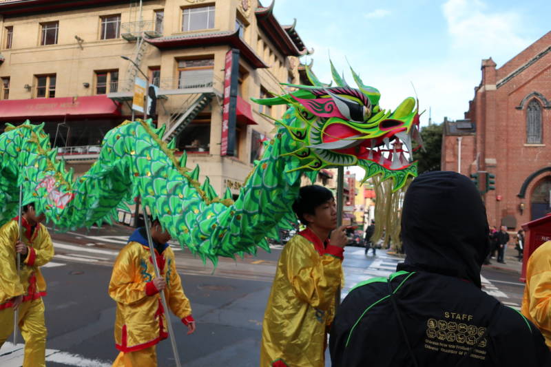 Performers prepare to take part in the procession during the Lunar New Year kickoff event in San Francisco's Chinatown.
