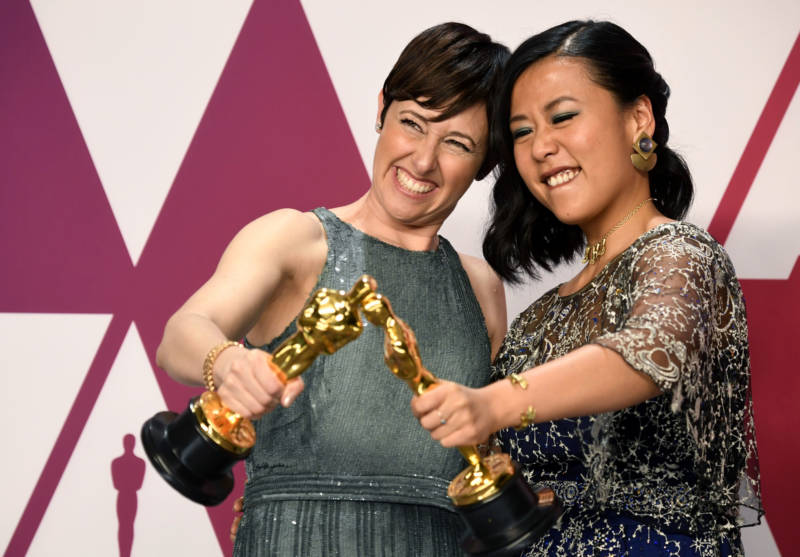 Becky Neiman-Cobb (L) and Domee Shi, winners of Best Animated Short Film for "Bao," pose in the press room during the 91st Annual Academy Awards at Hollywood and Highland on February 24, 2019 in Hollywood, California.