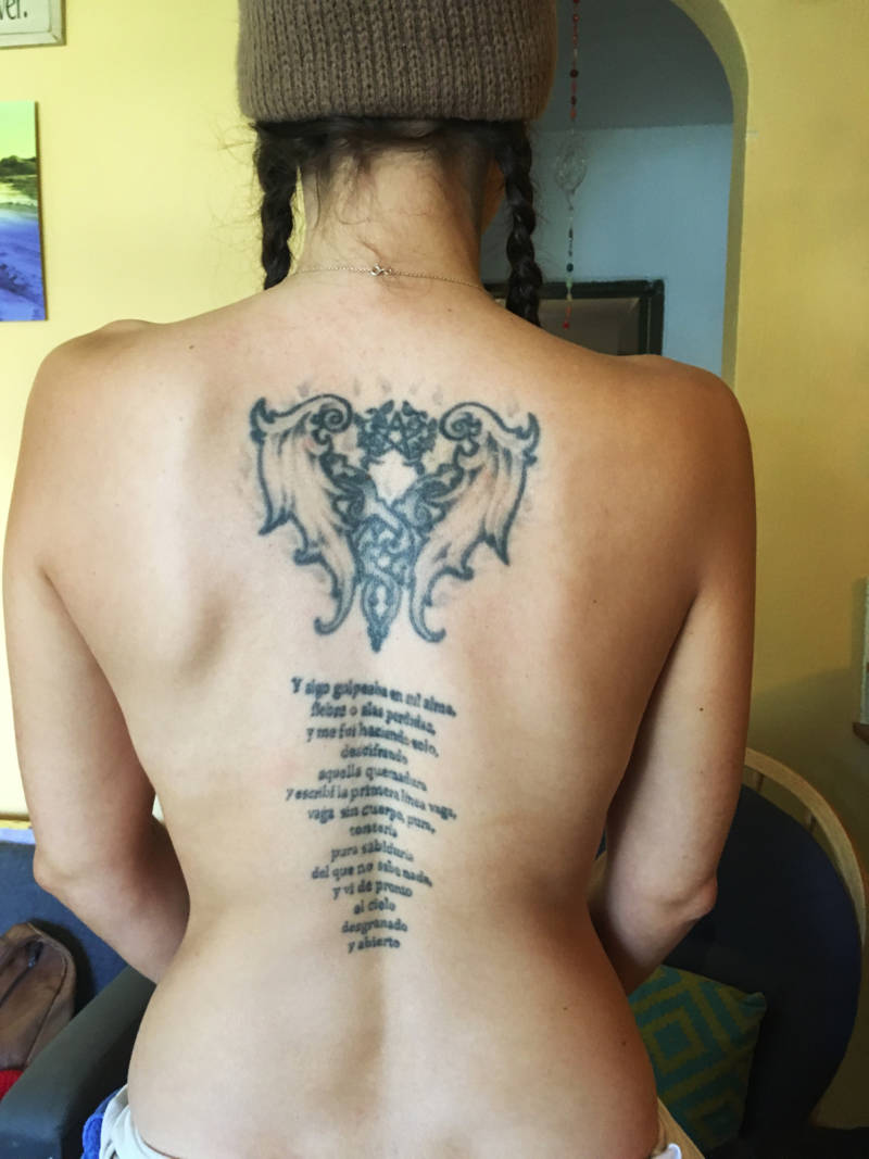 The tattoo on Erin's back which inspired her teacher's love poem