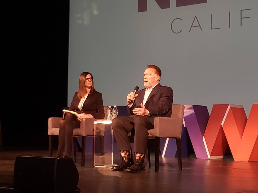 Former Governor Arnold Schwarzenegger speaks with former Assemblywoman Kristin Olsen on stage at the New Way California Summit in Sacramento, CA.