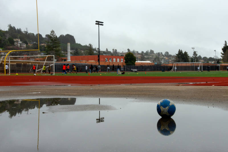 Students at Rudsdale Newcommer High School play soccer on the field they share with Castlemont High School.