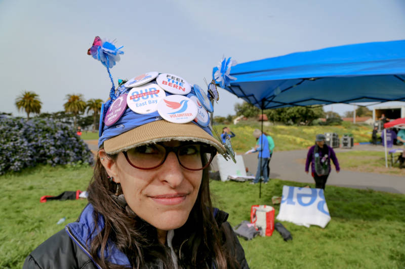 Ena Silva said she worked late last night on crafting her Bernie Sanders buttons and butterfly, flower antennas on her late grandfather’s hat.