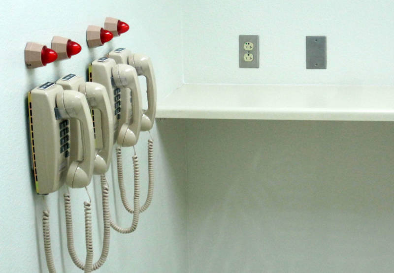 Phones line a wall of the lethal injection chamber at San Quentin State Prison, photographed in 2010.