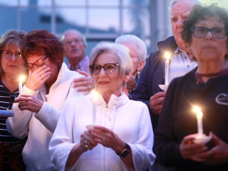 Mourners participate in a candle light vigil for the victims of the Chabad of Poway Synagogue shooting at the Rancho Bernardo Community Presbyterian Church on April 27, 2019 in Poway, California. A teenage gunman who wrote a hate-filled manifesto opened fire at the synagogue, killing one person and injuring three others including the rabbi as worshippers marked the final day of Passover, authorities said.