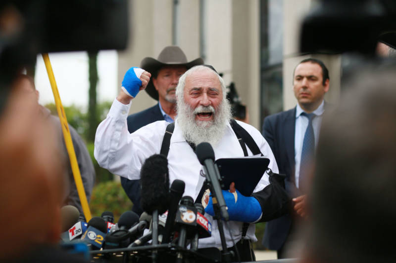 Executive Director Rabbi Yisroel Goldstein, who was shot in the hands, speaks to members of the media duringa press conference outside of the Chabad of Poway Synagogue on April 28, 2019 in Poway.