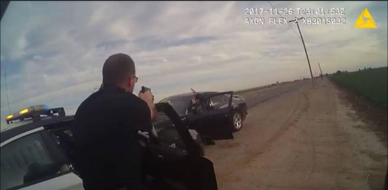A still image from the body camera worn by Hanford Police Corporal Chris Barker shows his perspective on the standoff between law enforcement and Juan Castro.