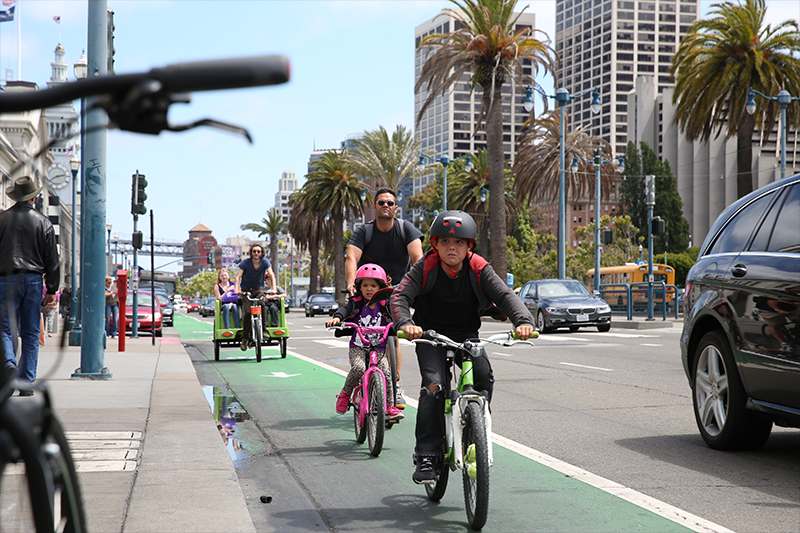 Families bike in San Francisco on July 18, 2014.