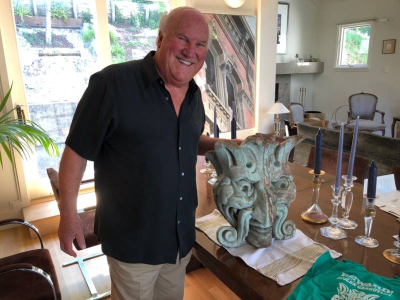 Architect and developer Glenn Storek at his home with a redwood gargoyle, one of many that were stolen off some of the Victorians in Old Oakland during the neighborhood's restoration and eventually recovered.