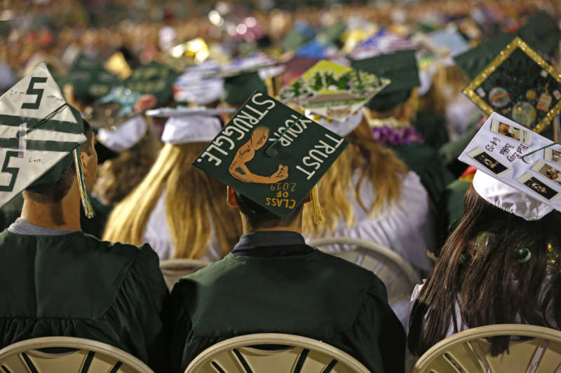 Seniors personalized their caps with messages of hope and inspiration.
