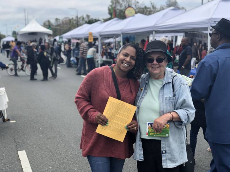 Former rent board commissioner Christina Murphy (L) and Margy Wilkinson (R), both Berkeley residents, used the Juneteenth festival to raise awareness of affordable housing. 'This whole area used to give back to families of low income and people of color,' said Murphy. 'When they started displacing people and taking out the businesses, we started losing the colors of Juneteenth.'