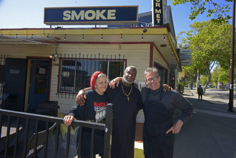 Tina Ferguson-Riffe (left) and Sean Hagler (right) stand with Joel McCarter (center) in front of Smoke Berkeley on May 28, 2019, in Berkeley. Ferguson-Riffe and Hagler hired McCarter after he graduated from the Quentin Cooks program at San Quentin State Prison.