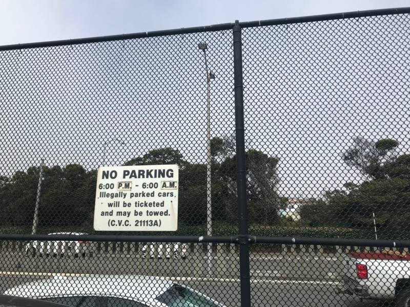 A sign posted on the inside of a parking lot near the Balboa Park BART in San Francisco. Two city supervisors have proposed using this site for a safe parking lot where people living in their vehicles can park legally and access services. It would be the city's first safe parking lot. July 16, 2019.
