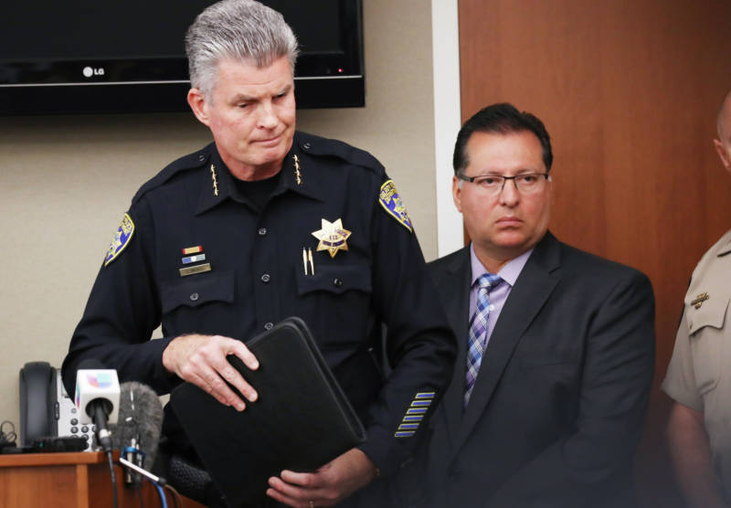 Gilroy Police Chief Scot Smithee (L) and Gilroy Mayor Roland Velasco attend a press conference the day after a mass shooting at the Gilroy Garlic Festival on July 29, 2019 in Gilroy.