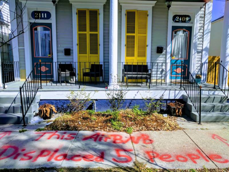 April Leigh spray-painted a message for tourists renting the New Orleans house in which she used to live after she was evicted from it and the new landlord converted it into a short-term rental property.