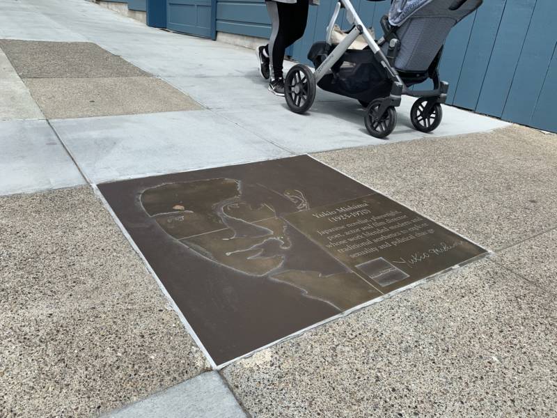 The sidewalk plaque of Yukio Mishima is situated on 19th Street in San Francisco, a quieter stretch of the Rainbow Honor Walk.